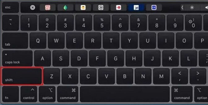 hold the Shift key on MacBook Pro keyboard